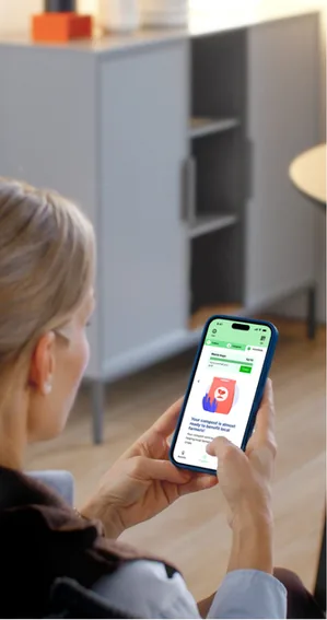 A person using the ScrapAsset app on their phone