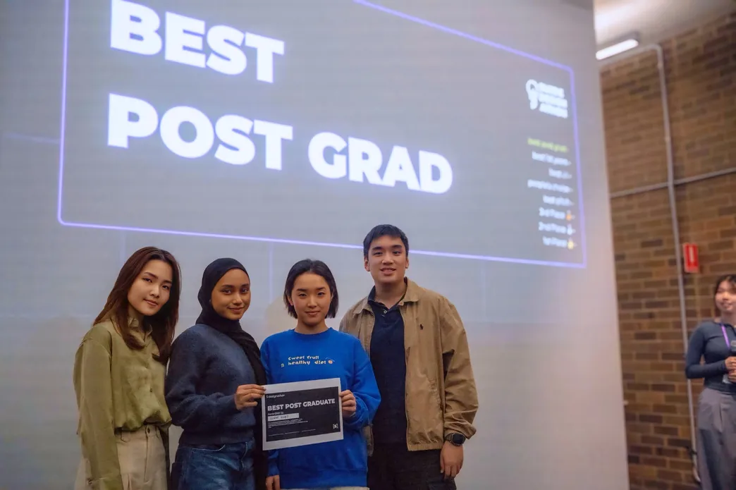 The ScrapAsset team holding the Best Postgraduate award certificate
